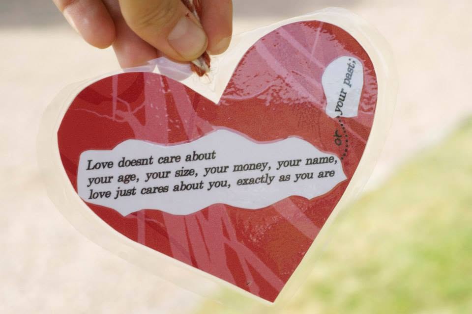Heart-shaped sign with words of wisdom